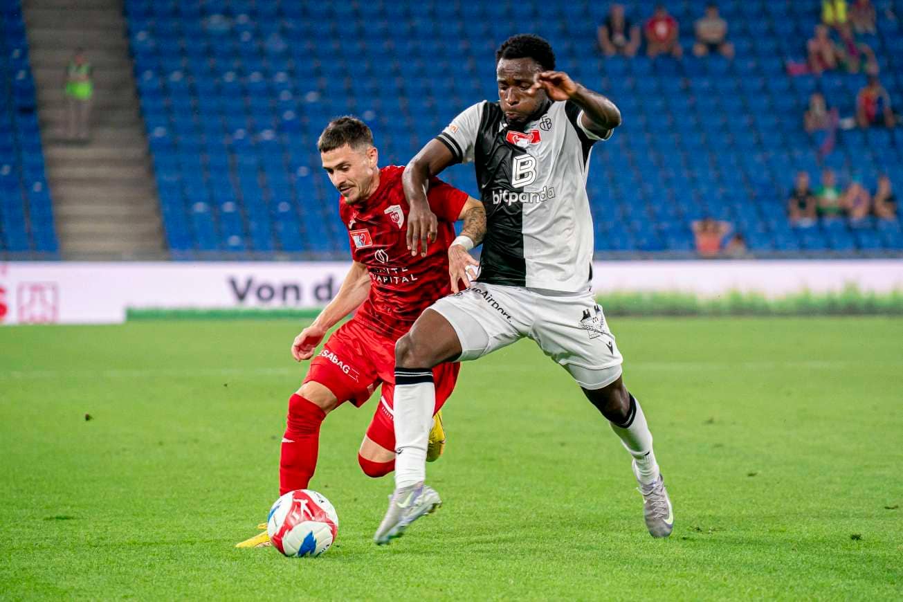 Philip Otele challenges an opponent